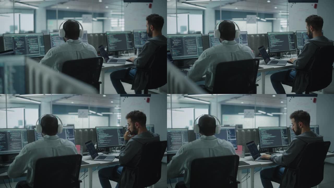 办公室: 专业的黑色IT程序员在台式电脑上工作时使用耳机。男性网站开发者，软件工程师开发应用程序，视