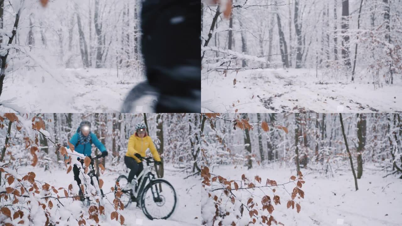 SLO MO夫妇带着前灯在白雪皑皑的森林小径上骑着自行车