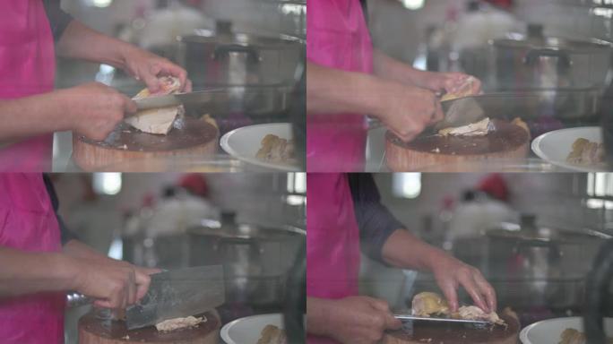 中国老人在厨房砍鸡吃家庭团圆饭春节