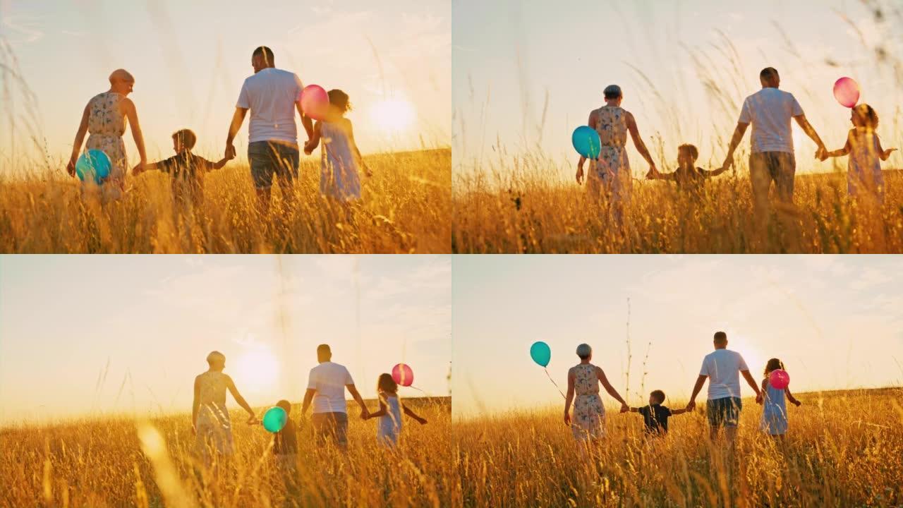 SLO MO家族在黄金时段在高高的羊茅草中行走时拿着气球