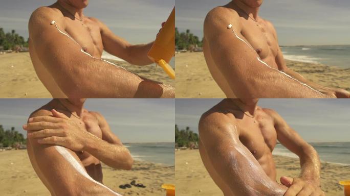 肌肉发达的人在海滩上使用防晒霜