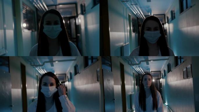 SLO MO Young女医生在医院走廊里摘下口罩