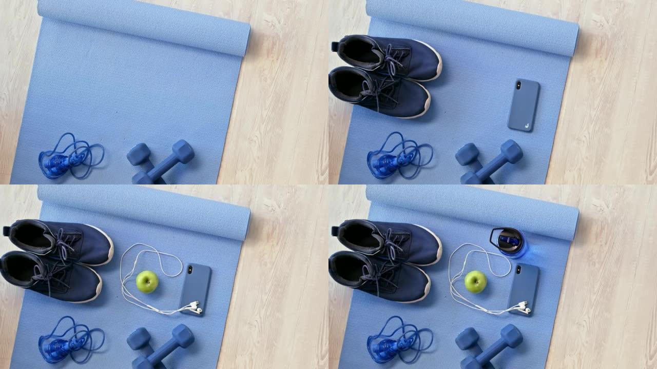 从蓝色瑜伽垫和健身器材上方放平。在锻炼过程中使用举重，哑铃，跳绳和手机。你的健身器材让你的锻炼变得例