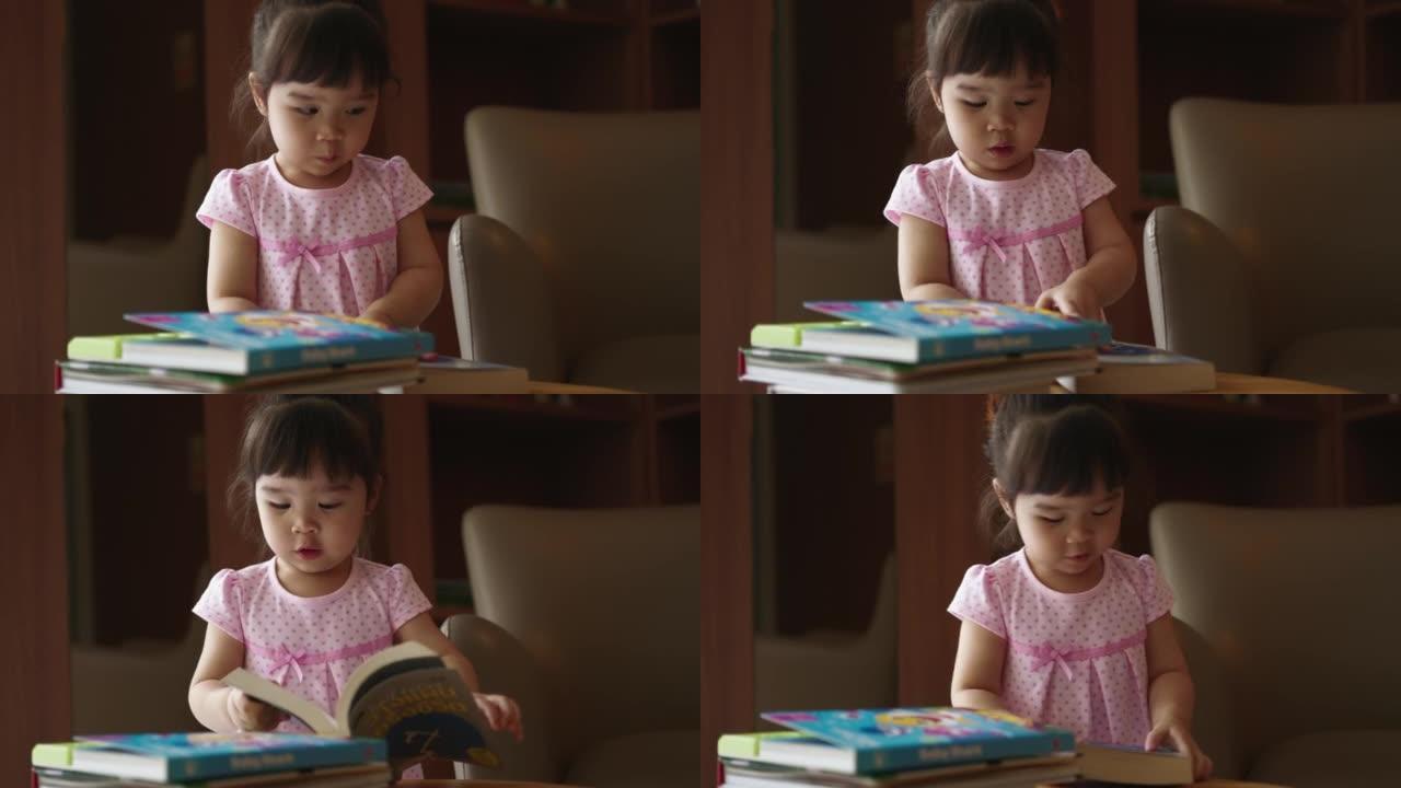 女儿喜欢在家看书翻阅书籍小女孩室内