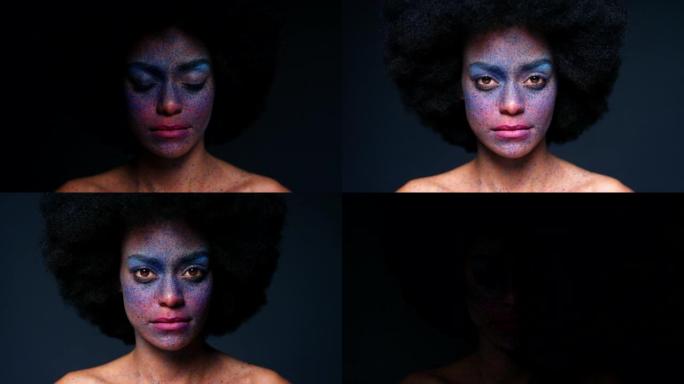 黑人女性在工作室的创意化妆和肖像，带有非洲和严肃的面孔，背景为模型。思考、沉思和专注于彩色化妆品飞溅