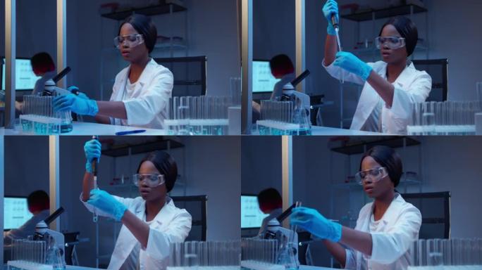 年轻的女性非裔美国人实验室助理戴着防护手套和医用外套，用玻璃试管进行化学实验