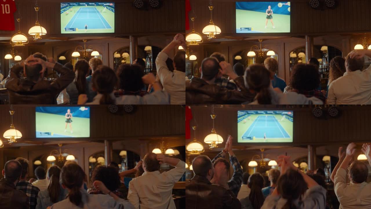 一群网球迷在电视上的体育酒吧观看国际直播。人们欢呼，支持他们的球员。当运动员进球并赢得冠军时，人群会