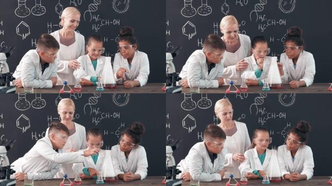 女教师和学童正在观察化学反应