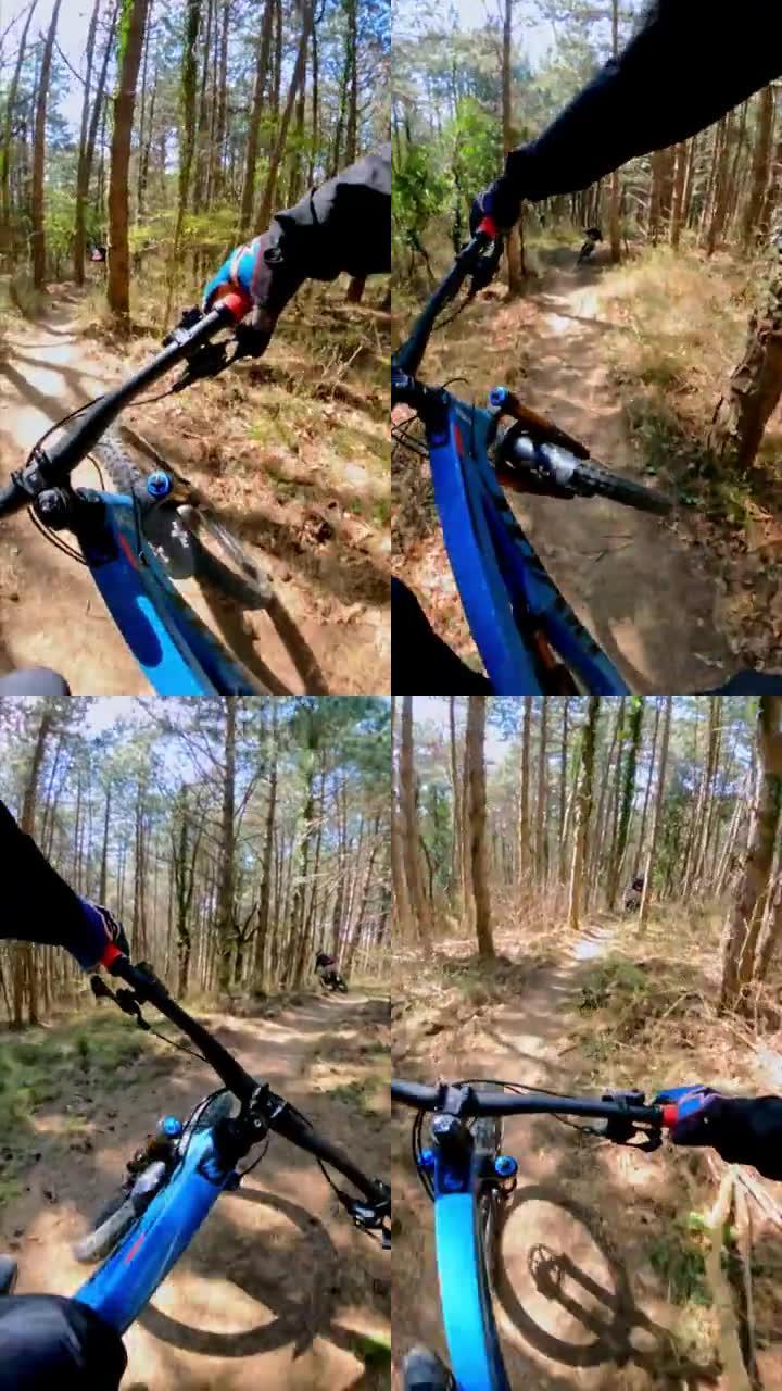 一名下坡山地自行车手在森林中超速行驶的垂直视频镜头