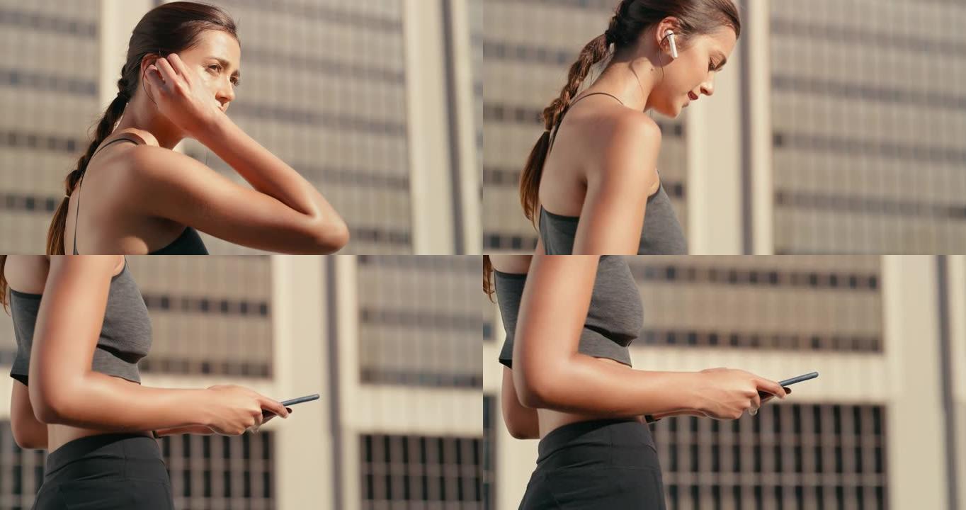 4k视频片段，一名妇女在外出跑步时放入耳罩并拿着手机