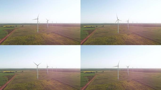 无云天空乡村景观中风力涡轮机的总体视图
