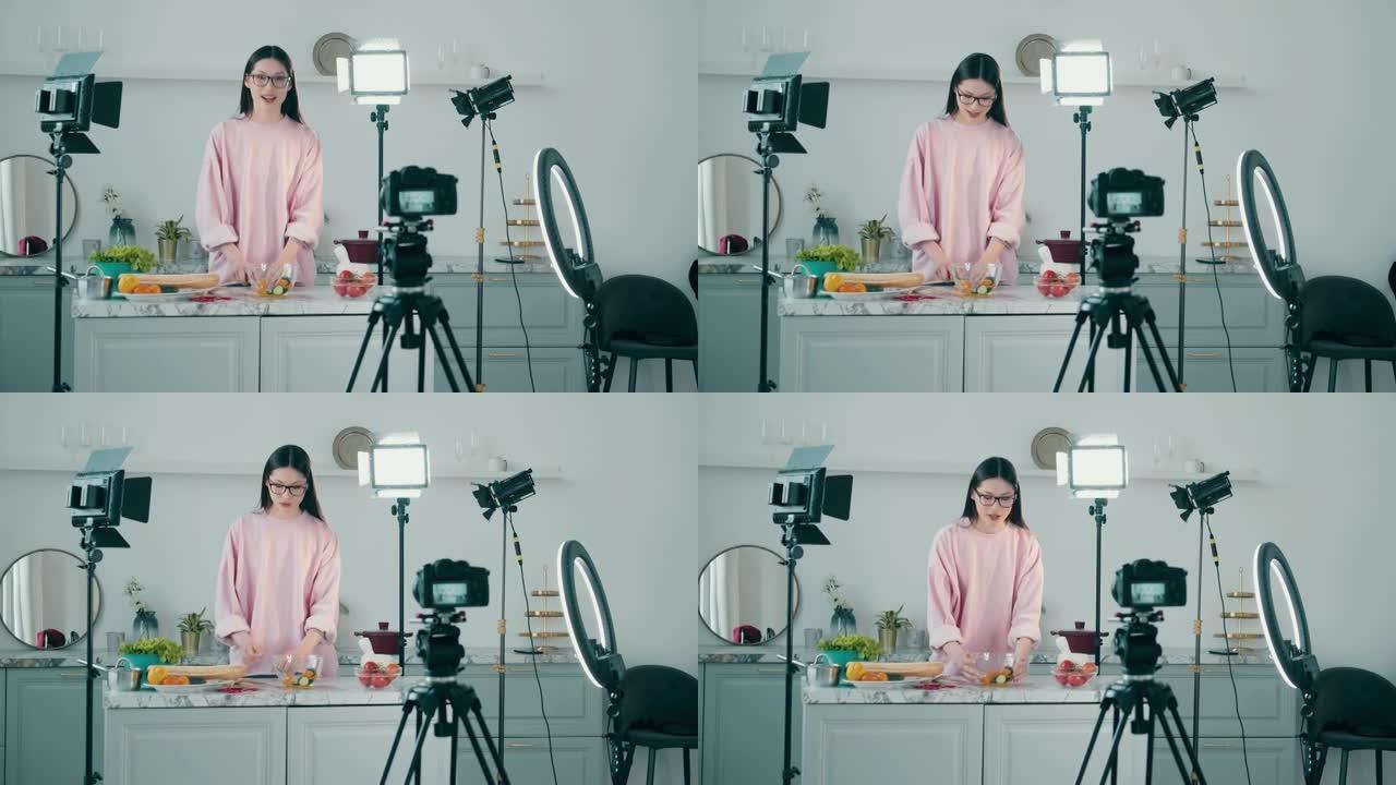 与一名年轻女子一起烹饪的工作室视频拍摄