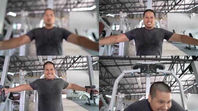 亚洲男子光头在健身房锻炼他的胸内肌肉