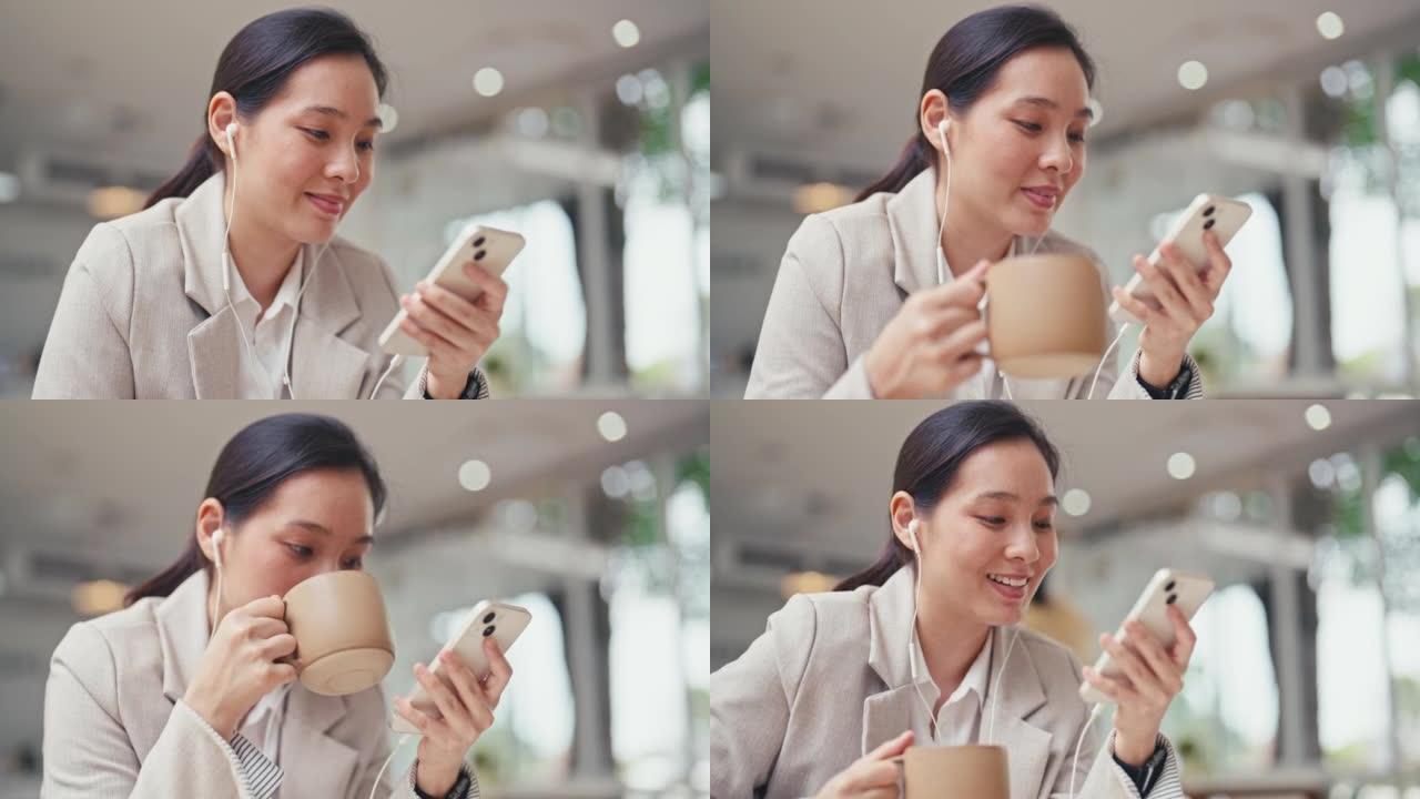 亚洲妇女拿着咖啡杯使用手机