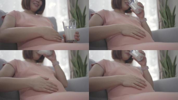 健康孕妇亚洲妇女在子宫内喝牛奶保健婴儿
