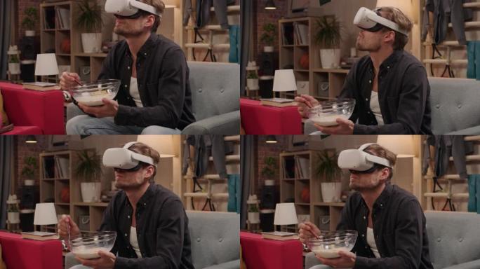 电视情景喜剧概念: 使用虚拟现实耳机的家伙在客厅吃早餐。关于网络成瘾的有趣素描。喜剧系列广播网络频道