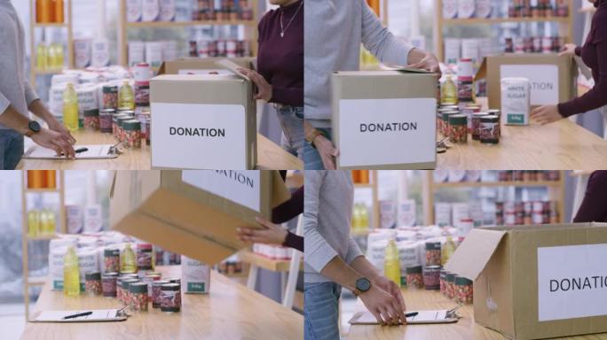 4k视频片段，一对夫妇在将食物放入盒子之前检查要捐赠的食物