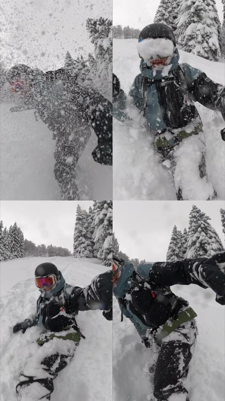 自由式滑雪板从积雪覆盖的斜坡上下来的垂直自拍照