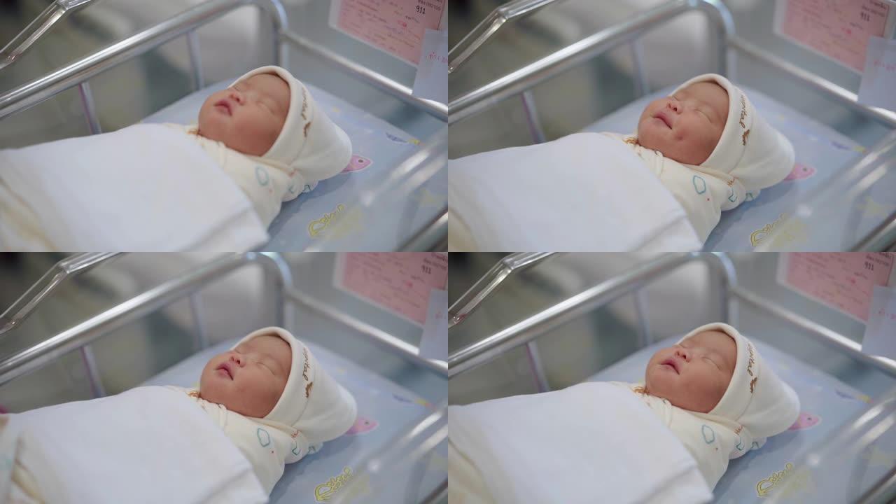 医院婴儿床中的新生男婴/女孩