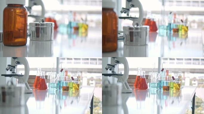 实验室用化学试剂试管、烧杯和显微镜，无人
