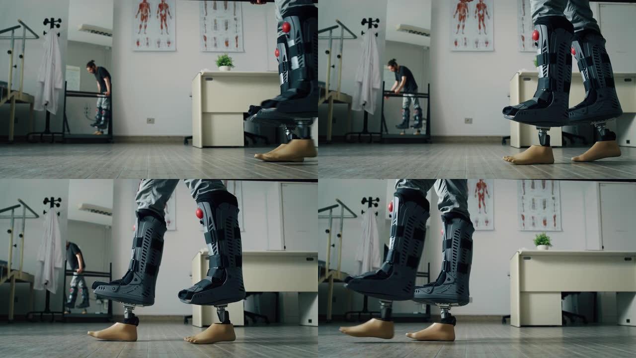 年轻的生物医学工程师正在为残疾患者测试新的仿生肢体假体。男人戴着适配器来评估人造脚的功能。使用康复双