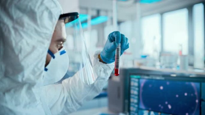 微生物学实验室: 医学家穿着无菌工作服，面罩和口罩，开发疫苗，药物，抗生素，新型冠状病毒肺炎试管和血