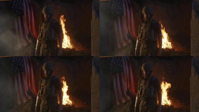 一名受伤士兵在火和美国国旗附近