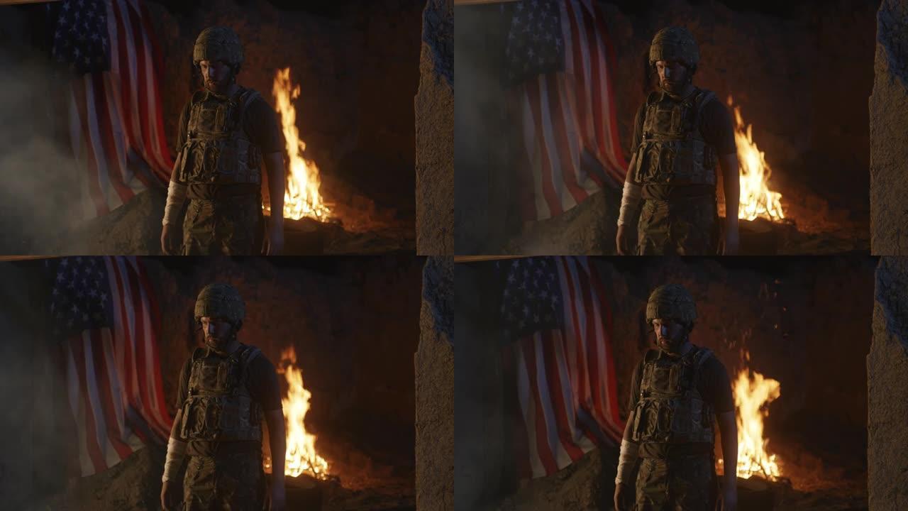 一名受伤士兵在火和美国国旗附近