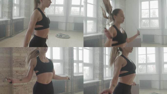 运动女子在锻炼时跳绳