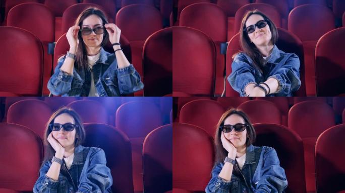 一位女士在看电影时戴上3D眼镜
