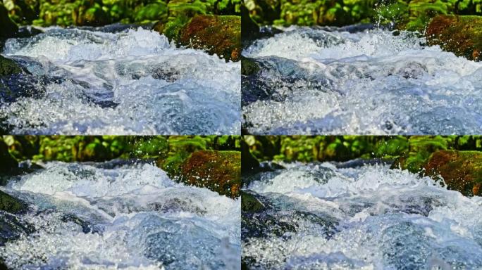 时间扭曲SLO MO水从小溪中溅起，从岩石上流过
