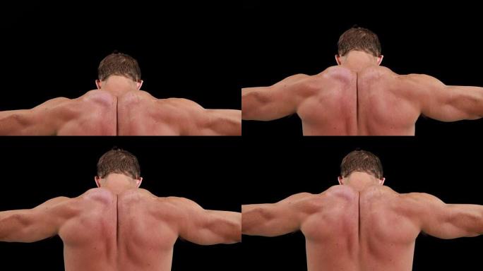肌肉发达的人展示他的背部肌肉