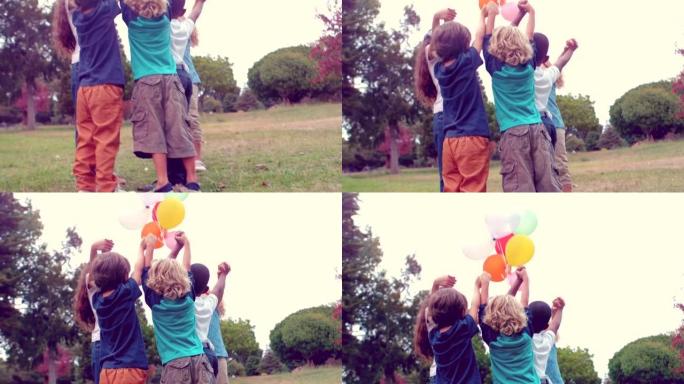 快乐的孩子拿着气球