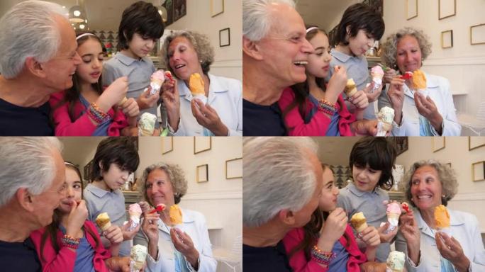 孙子们和祖父母分享冰淇淋，看起来都很开心，也很微笑