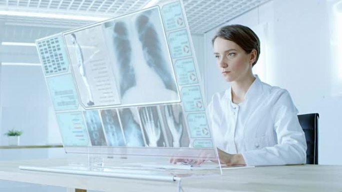 在不久的将来，美丽的女医生在透明的计算机显示器上工作。屏幕显示患者完整的病史，x射线和测试结果。