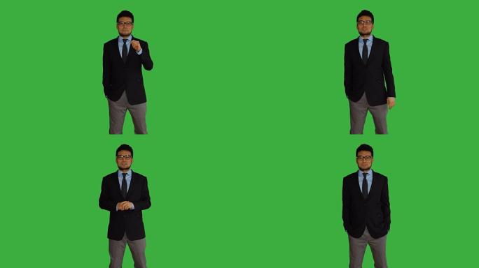 年轻的亚洲男子孤立在绿屏背景。代表商业战略思想的商人肖像。职业生活方式镜头。