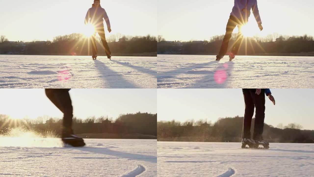 4k十几岁的男孩在阳光明媚的田园诗般的冰冻湖上滑冰和滑行，慢动作