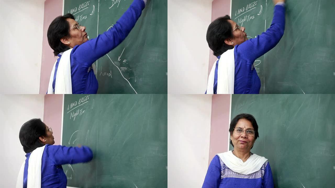 印度高级教师擦拭绿板上的擦除内容