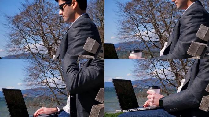 商人在公园使用笔记本电脑4k