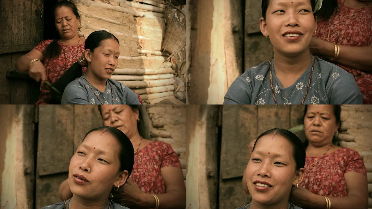 亚洲人：一位为儿媳梳头的成熟女性