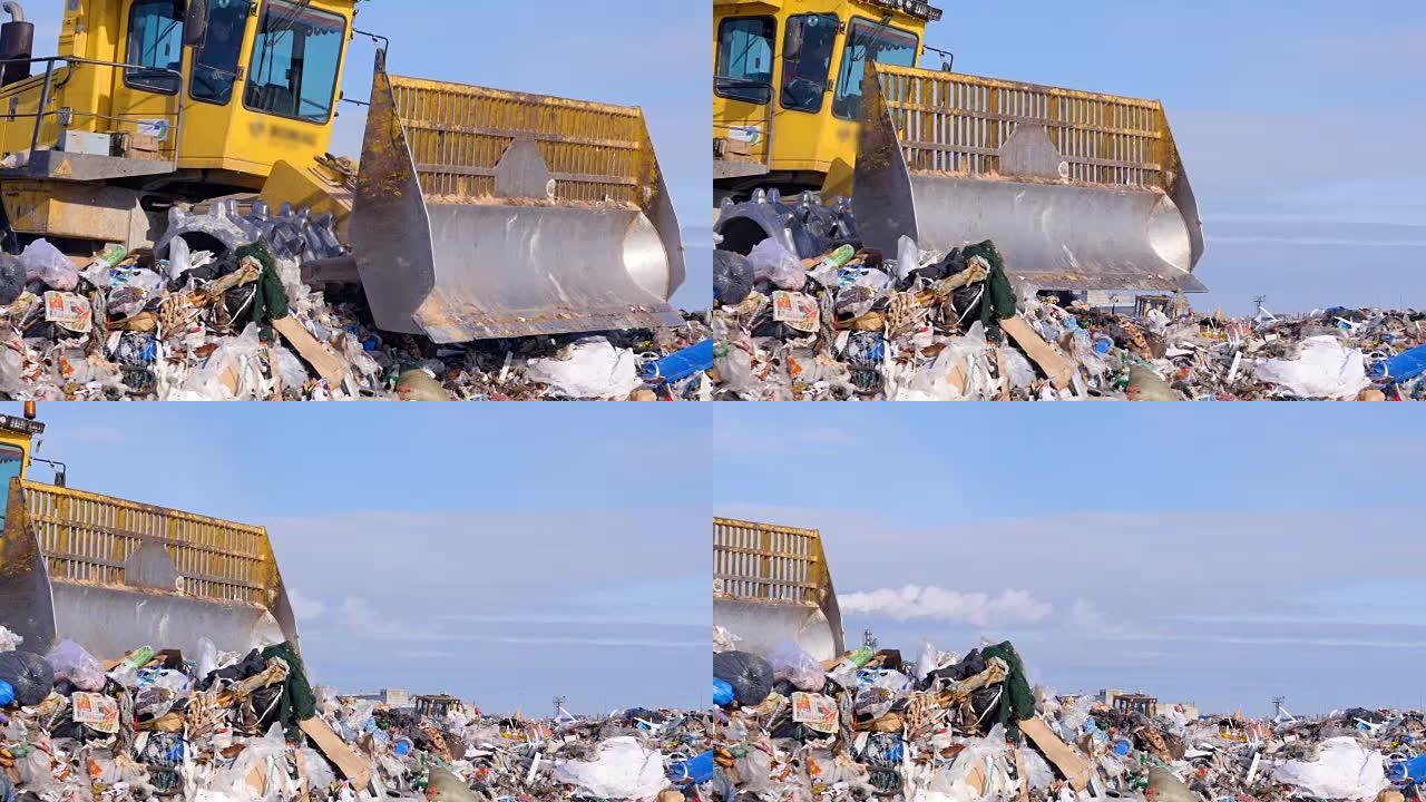 在城市垃圾场工作的垃圾填埋场拖拉机的近景。4K。