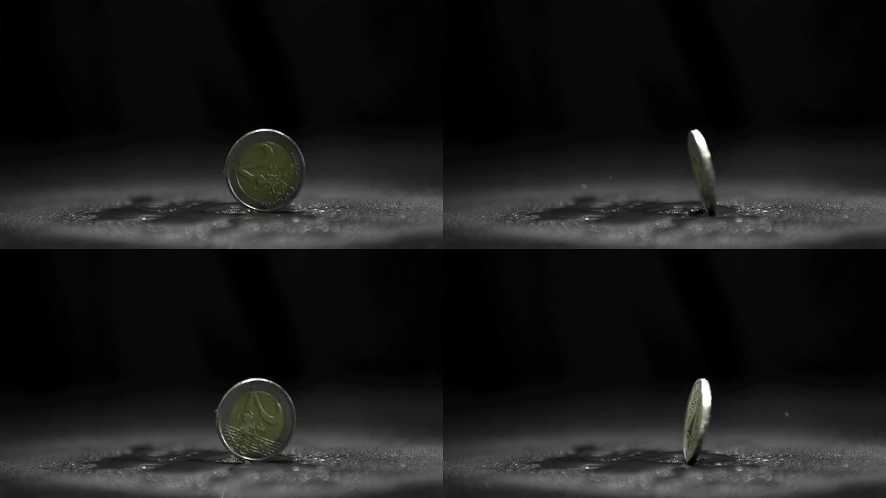 两个欧元硬币在黑色背景上旋转