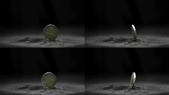 两个欧元硬币在黑色背景上旋转