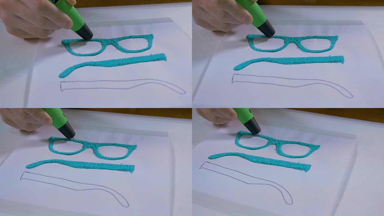 4K.男子手与3D笔打印眼镜。现代技术工艺。