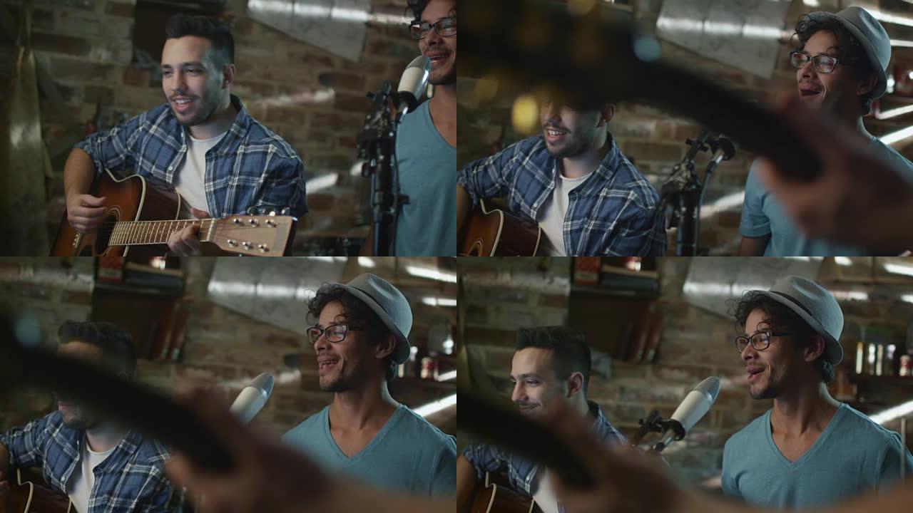 乐队在录制歌曲并在车库的家庭工作室练习时唱歌和弹吉他。