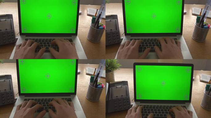 使用带有绿屏的笔记本电脑的商人特写