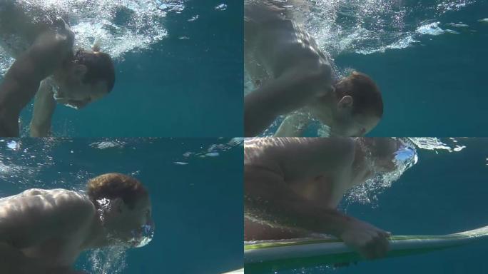 水下慢动作: 人在清澈的海水中练习鸭子潜水技术