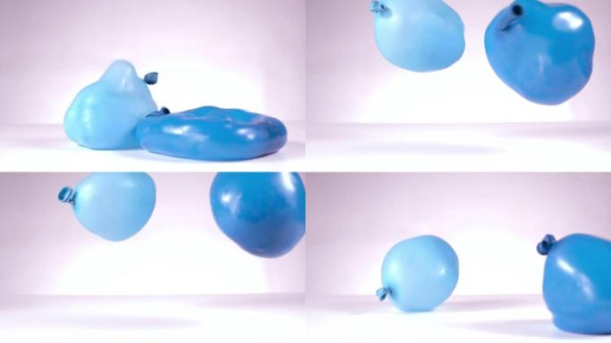 两只蓝水气球坠落