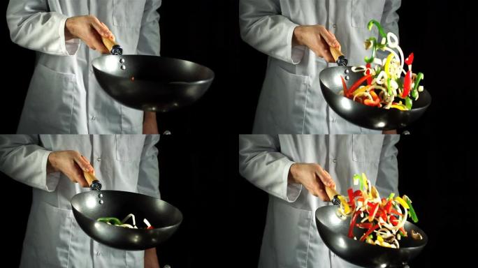 厨师在炒锅里扔蔬菜炒菜