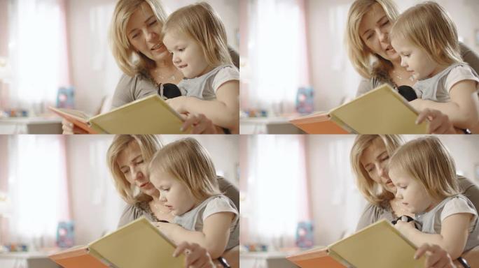 可爱的小女孩坐在祖母的腿上，他们读儿童读物。慢动作。